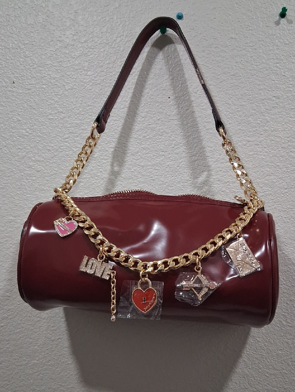 Juicy Couture Burgundy Patent Barrel Shoulder Bag with Gold Charm Chain